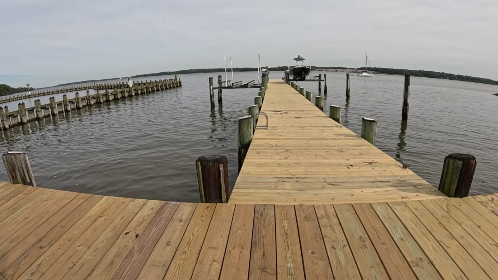 Open wooden approach to the pier identified by the visitor