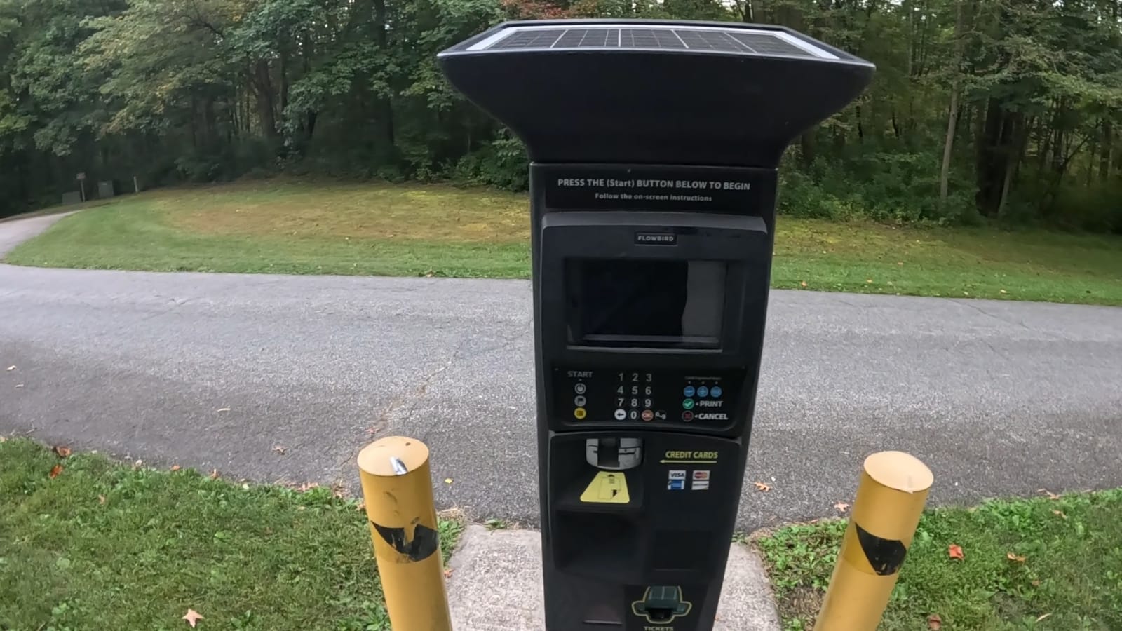 The solar-topped payment machine at the park entrance.